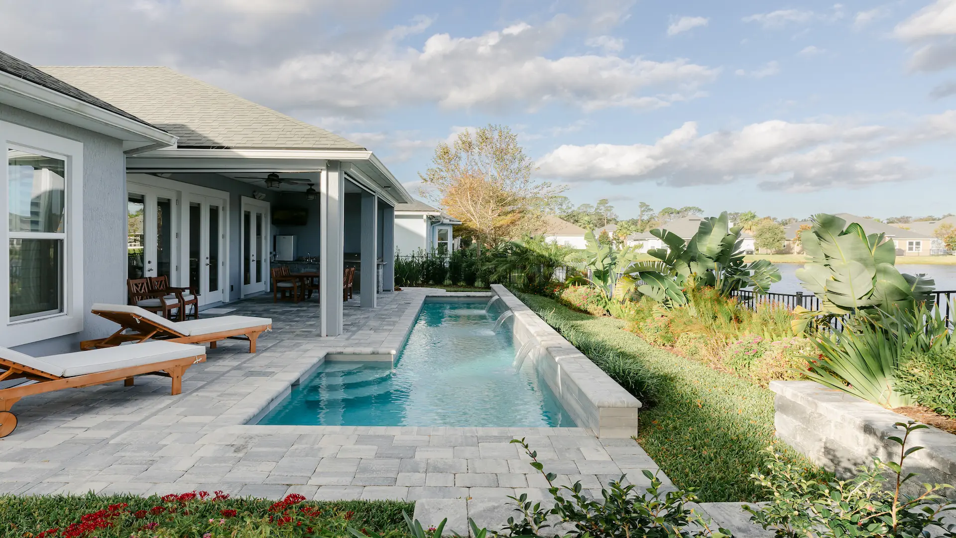 Custom Pool with Water Feature - Poolside Escape an Amelia Outdoors Design