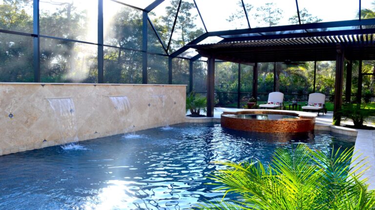 Enclosed Pool with Waterfall | Wonderwall an Amelia Outdoors Design