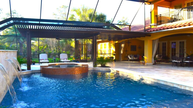 Enclosed Pool with Waterfall | Wonderwall an Amelia Outdoors Design